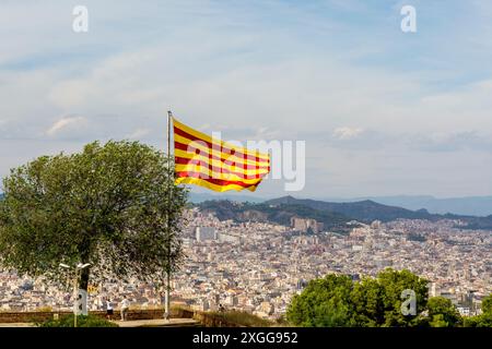 Catalan flag flies over the Montjuic Castle old military fortress on Montjuic Mountain overlooking the city, Barcelona, Catalonia, Spain, Europe Stock Photo