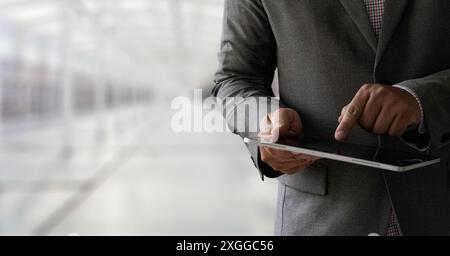 Digital tablet computer close up man using tablet hands man multitasking with isolated screen Stock Photo