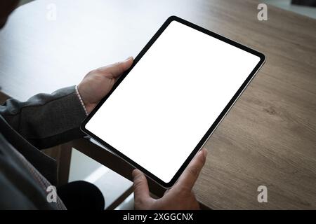 Businessman Using tablet with blank screen for design mockup device Tablet with blank screen for design mockup Stock Photo