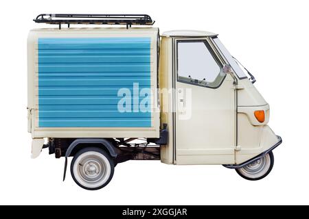 Side view of a vintage Italian three wheeled scooter van isolated on a white background Stock Photo