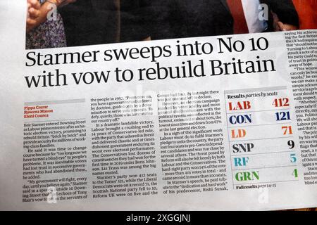 PM Keir 'Starmer sweeps into No 10 (Downing Street) with vow to rebuild Britain' Guardian newspaper headline election article 6 July 2024 London UK Stock Photo