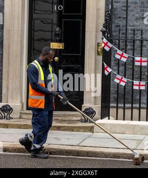 London, UK. 09th July, 2024. street cleaner at 10 Downing Street London. Credit: Ian Davidson/Alamy Live News Stock Photo