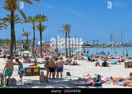 Crowded beach on a hot sunny day in May, 2024, in El Arenal, Playa de Palma, Mallorca, Balearics, Spain Stock Photo