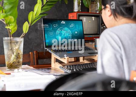 Businesswoman hands working with laptop computer, tablet and smartphone in modern office with virtual icon diagram at modern nofiz in morning light. Stock Photo