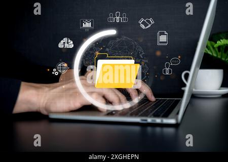 Document management system concept, Businessman working on laptop with electronic document, folder and files icon. IT consultant working on laptop com Stock Photo