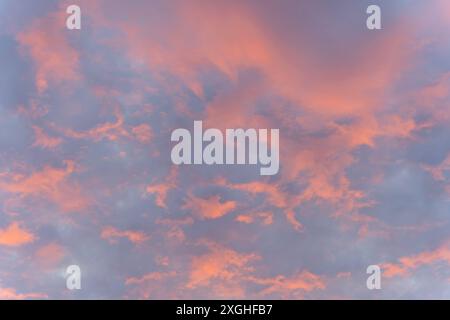 Sky and cloud in bright rainbow colors and Colorful smooth sky. The beauty of the sky and the red orange clouds in sunset background wallpaper. Stock Photo