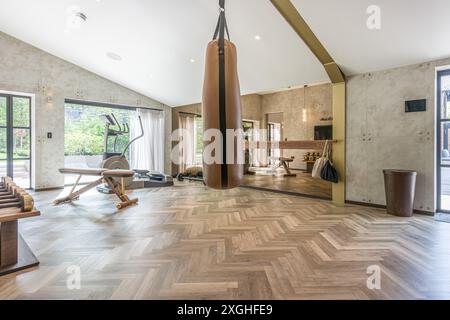 Large executive house with pool house, gym and outdoor kitchen in a leafy suburb of England Stock Photo