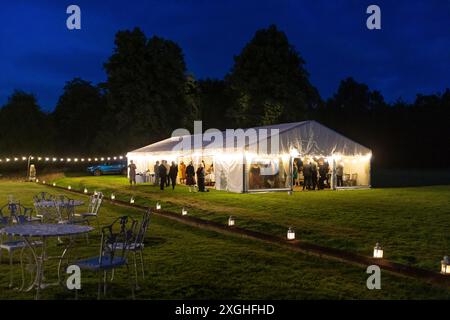 Marquee in the grounds of Chiddingstone Castle hosting a wedding reception, Chiddingstone, Kent Stock Photo