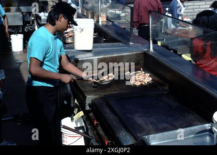 San Pedro CA USA 1983.  San Pedro wharf with fish market, boutique shops, outdoor sea food dining. Stock Photo