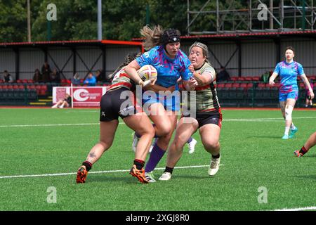 Female rugby player being tackled Stock Photo