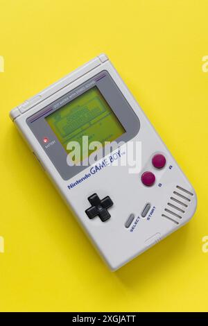 Classic 1989 Nintendo Game Boy handheld games console, showing the Super Mario Land game Stock Photo