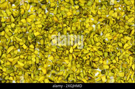 Ground, milled, crushed or granulated pistachio background Stock Photo