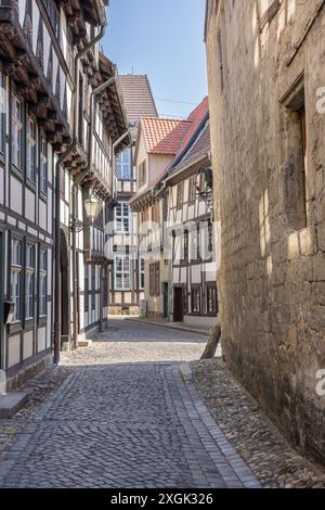 Old half-timbered houses in the old city of Quedlinburg, Saxony-Anhalt, Germany. The street is called Hölle (hell). Stock Photo