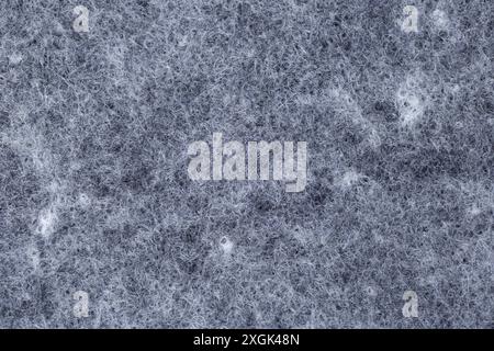 Detail of the texture of a gray and white thread rug. Stock Photo