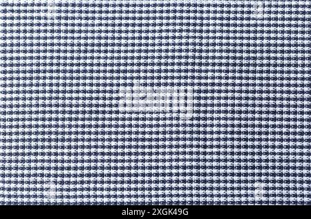 A checkered print fabric with a black and white color combination. The pattern is made up of squares and rectangles in a repetitive way. Stock Photo
