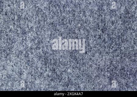 Detail of thick gray fabric texture. You can see the white and gray threads that make it up and its chaos. Stock Photo
