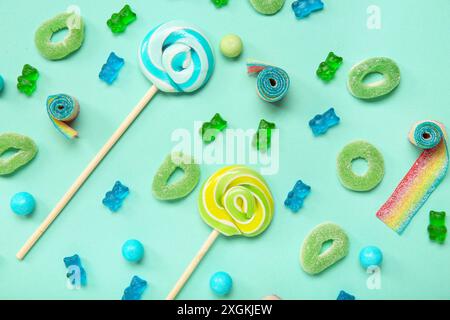 Composition with different candies on color background Stock Photo