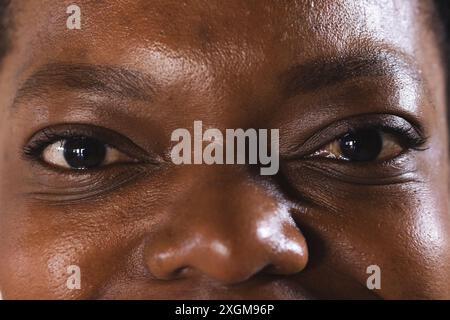 Close-up of an African American woman's eyes, with copy space unaltered. Her gaze reflects a sense of calm and confidence. Stock Photo