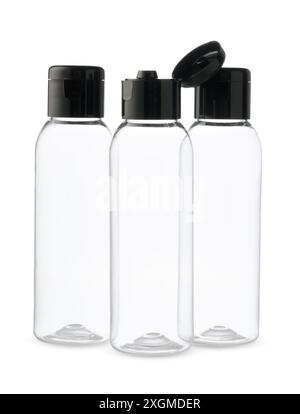 Three Clear Plastic Bottles With Black Caps on a White Background Stock Photo