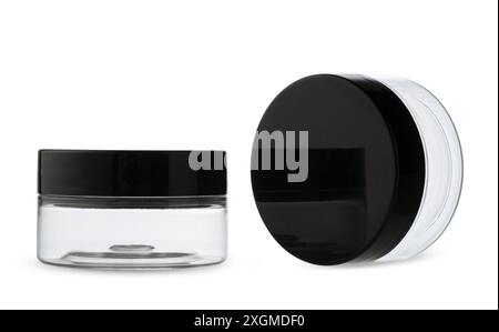 Two Clear Plastic Jars With Black Lids Stock Photo