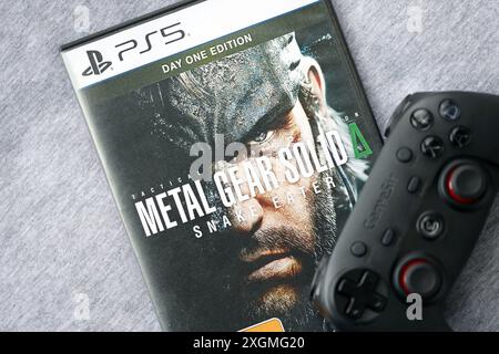 KYIV, UKRAINE - JUNE 26, 2024 Metal Gear Solid Delta Snake Eater PS5 video game disc box for console gaming. Popular video game disc close up Stock Photo