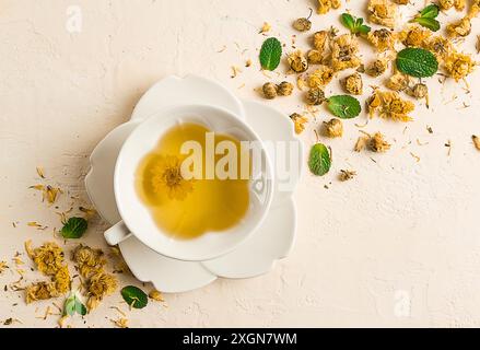 Chrysanthemum tea, drink, white cup, mint, chrysanthemum buds, close-up, no people Stock Photo