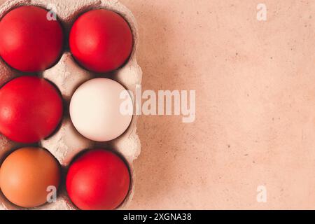 Easter eggs, dark red, magenta, top view, in a paper container, no people Stock Photo