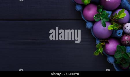 Easter eggs, purple and lilac, on a gray wooden table, Easter card, banner, selective focus, horizontal Stock Photo