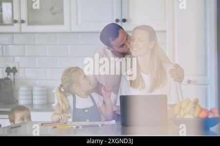 Family, kitchen and parents with children for homework or study with remote work on counter. Tutor, education and student daughter for distance Stock Photo