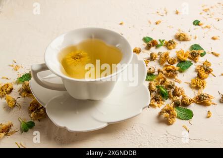 Chrysanthemum tea, drink, white cup, mint, chrysanthemum buds, close-up, no people Stock Photo