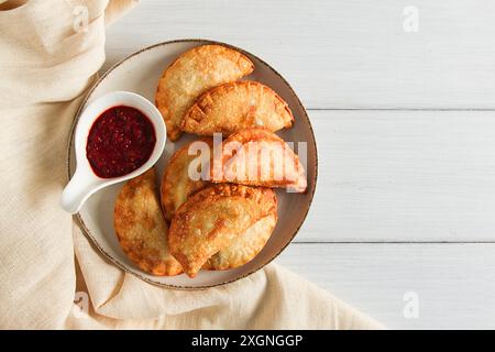 Fried chebureks, close-up, on a light background, no people Stock Photo