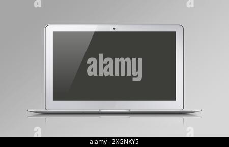 A sleek silver laptop closed against a gray background with reflections Stock Photo