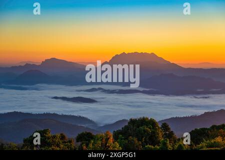 Tropical forest nature landscape view with mountain range sunrise with moving cloud mist at Huai Nam Dang National Park, Chiang Mai Thailand Stock Photo