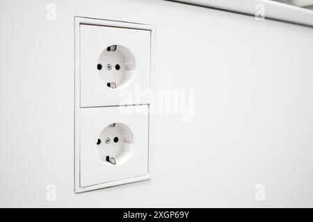 Electrical jack white plastic socket. Copy space Stock Photo