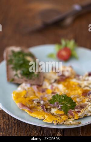 Scrambled eggs on a blue plate Stock Photo