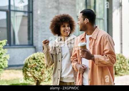 An African American couple walking and using sign language to communicate. Stock Photo