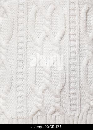 Real white knitted fabric with  cable pattern textured background Stock Photo