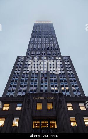 Looking Up at the Empire State Building New York from Street Level Stock Photo