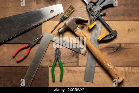 Stock photos of hand tools on rough wood background Stock Photo