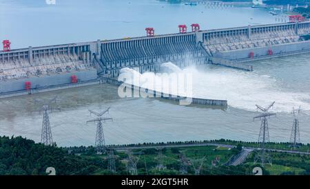 YICHANG, CHINA - JULY 10, 2024 - Photo taken on July 10, 2024 shows the Three Gorges Dam releasing flood water for the first time this year in Yichang Stock Photo