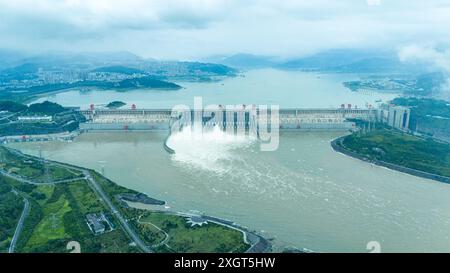 YICHANG, CHINA - JULY 10, 2024 - Photo taken on July 10, 2024 shows the Three Gorges Dam releasing flood water for the first time this year in Yichang Stock Photo