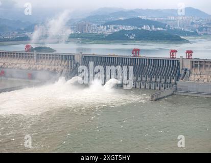 YICHANG, CHINA - JULY 10, 2024 - Photo taken on July 10, 2024 shows the Three Gorges Dam releasing flood water for the first time this year in Yichang Stock Photo