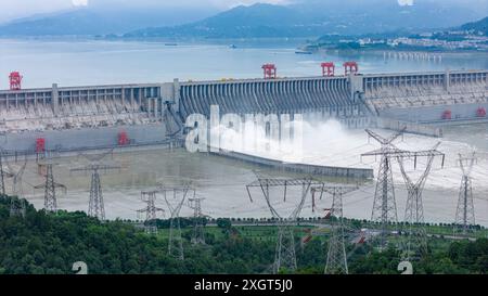 YICHANG, CHINA - JULY 10, 2024 - Photo taken on July 10, 2024 shows the Three Gorges Dam releasing flood water for the first time this year in Yichang Stock Photo