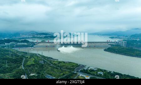 YICHANG, CHINA - JULY 10, 2024 - Photo taken on July 10, 2024 shows the Three Gorges Dam releasing flood water for the first time this year in Yichang Stock Photo