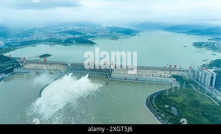 YICHANG, CHINA - JULY 10, 2024 - Photo taken on July 10, 2024 shows the Three Gorges Dam releasing flood water for the first time this year in Yichang Stock Photo