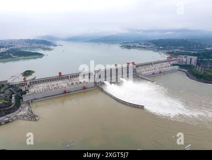 YICHANG, CHINA - JULY 10, 2024 - Photo taken on July 10, 2024 shows the Three Gorges Dam releasing flood water for the first time this year in Yichang Stock Photo