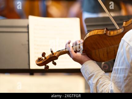 Close up of hand playing on violin Stock Photo