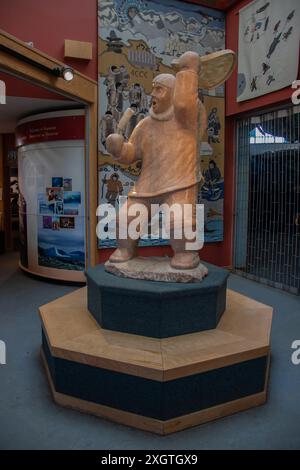 Marble stone sculpture of the Drum Dancer at Unikkaarvik Visitor's Centre on Sinaa Street in Iqaluit, Nunavut, Canada Stock Photo