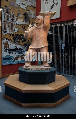 Marble stone sculpture of the Drum Dancer at Unikkaarvik Visitor's Centre on Sinaa Street in Iqaluit, Nunavut, Canada Stock Photo