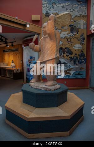 Marble stone sculpture of the Drum Dancer at Unikkaarvik Visitor's Centre on Sinaa Street in Iqaluit, Nunavut, Canada Stock Photo